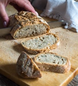 A loaf of bread being sliced