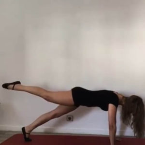 A woman doing a plank isometric exercise.
