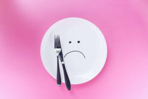 Empty plate with a frown.