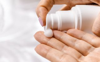 Anti-wrinkle serum-woman applying serum on her fingers