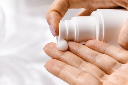 Anti-wrinkle serum-woman applying serum on her fingers