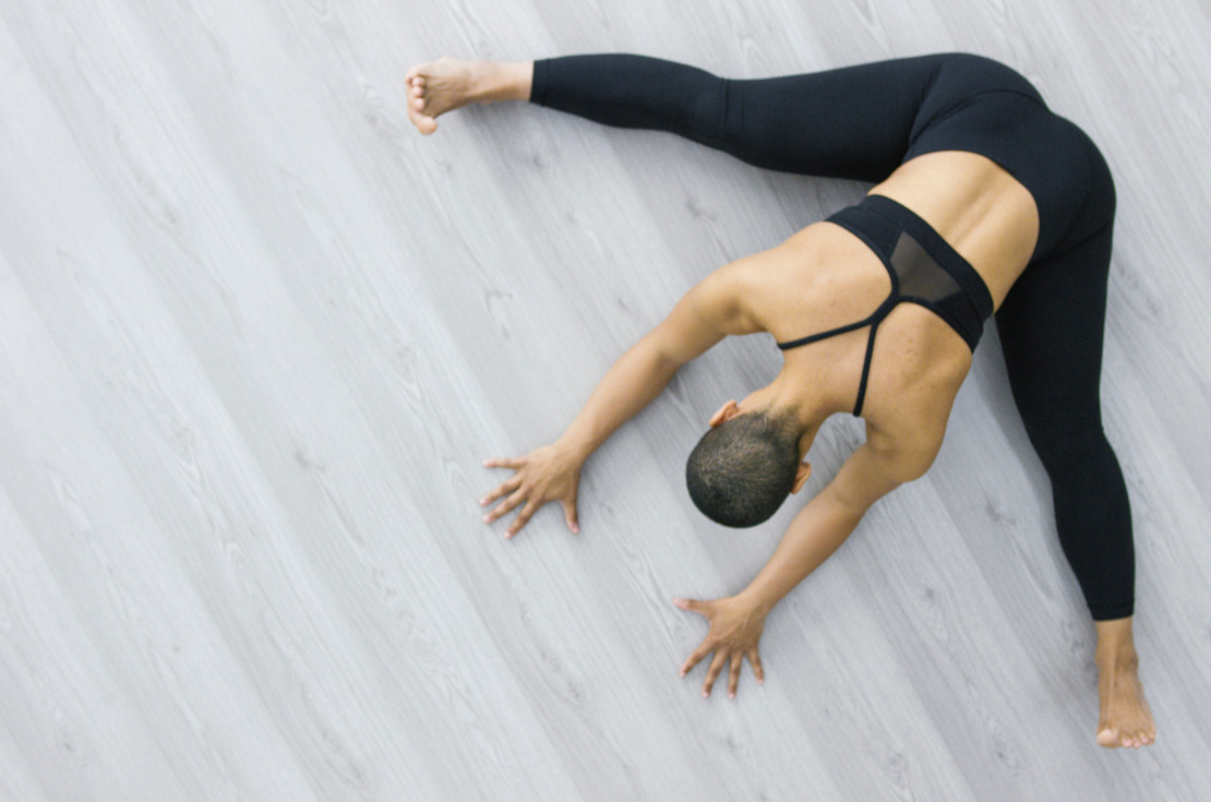 A-woman-stretching-on-the-floor