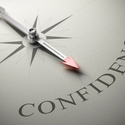 gaining-self-confidence-needle of a compass pointing at the word confidence-3D render-concept image of self-confidence