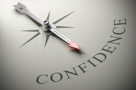 gaining-self-confidence-needle of a compass pointing at the word confidence-3D render-concept image of self-confidence