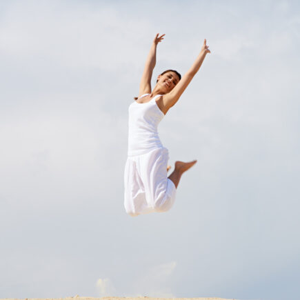 woman jumping outdoors