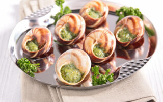 weird French Christmas traditional food-Bourgogne snails in garlic parsley butter sauce