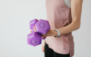 self-motivated to workout-woman in sportswear with dumbbells