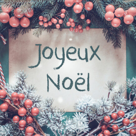 Unique Christmas traditions in France-brown paper with French text joyeux noel means merry christmas