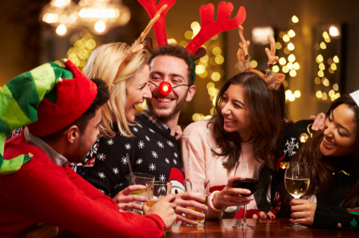 Christmas fitness health tips-friends enjoying Christmas drinks in bar