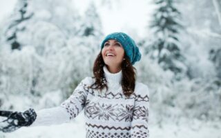 christmas mental health tips-woman in winter forest getting some fresh air