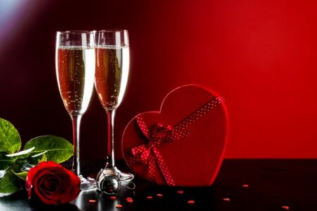 Valentines-day-in-france-traditions-champagne-red-rose-heart-shaped-box-background