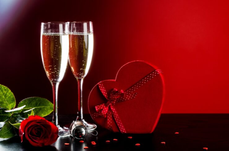 Valentines-day-in-france-traditions-champagne-red-rose-heart-shaped-box-background