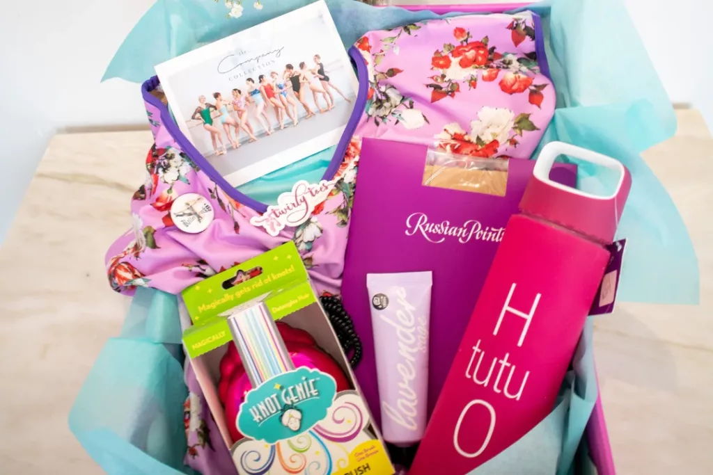 Dancers subscription box with leotard, water bottle, hand cream